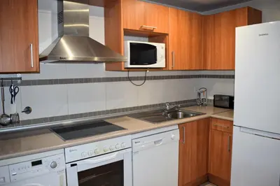 Una cocina o zona de cocina en Argualas - Triplex con piscina - By CARDI Suites
