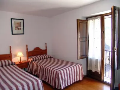 Cama o camas de una habitación en Apartamento Miguel Torla Ordesa