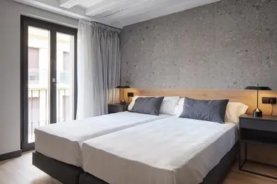 Cama o camas de una habitación en Hostal Espoz y Mina