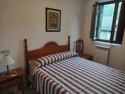Cama o camas de una habitación en Centro Torla 4pax Apartamento