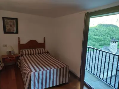 Cama o camas de una habitación en Centro Torla-Ordesa 5pax Apto Miguel