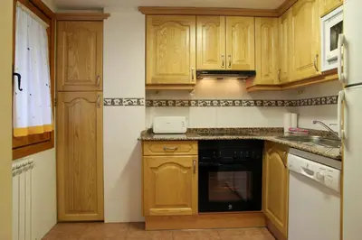 Una cocina o zona de cocina en Apartamentos Chuanon