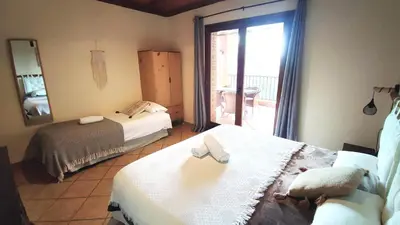 Cama o camas de una habitación en AldeaMia, Cozy villa for 8 people, pool, mountain view, beach at 8 min