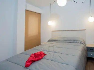 Cama o camas de una habitación en Apartamentos El Pilar