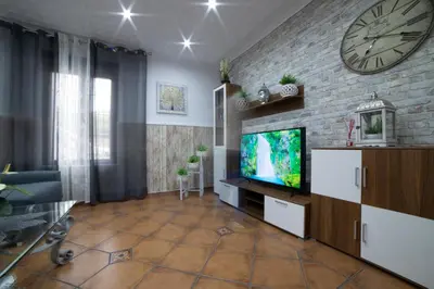 Una televisión o centro de entretenimiento en APARTAMENTO LA VEGUILLA