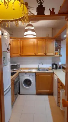 Una cocina o zona de cocina en Apartamento dúplex acogedor con piscina en Rialp