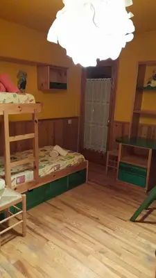 Cama o camas de una habitación en Apartamento dúplex acogedor con piscina en Rialp