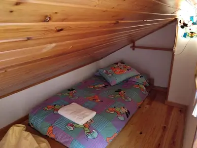 Cama o camas de una habitación en Apartamento dúplex acogedor con piscina en Rialp