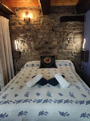 Cama o camas de una habitación en BORAU - Casa 150m2 con JARDÍN Y BARBACOA