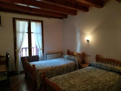 Cama o camas de una habitación en Pension Casat