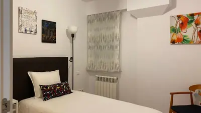 Cama o camas de una habitación en LC Apartamentos César Augusto