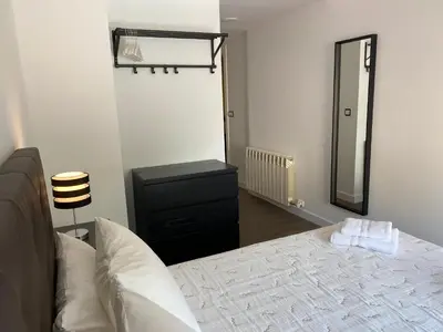 Cama o camas de una habitación en LC Apartamentos César Augusto