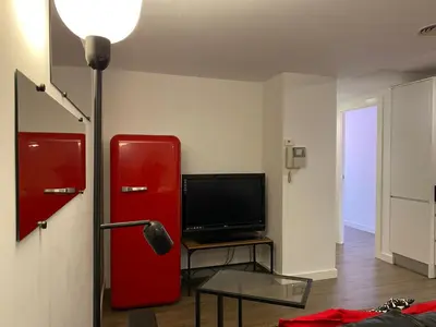 Una televisión o centro de entretenimiento en LC Apartamentos César Augusto