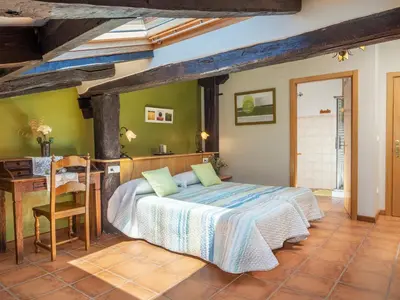 Cama o camas de una habitación en Casa rural ALBIRENA