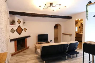 Una televisión o centro de entretenimiento en Rita, apartament ideal per a dos