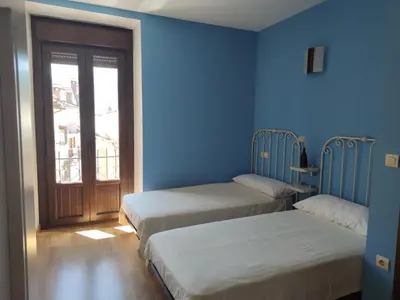 Cama o camas de una habitación en Albergue rural l'Almada de Yebra