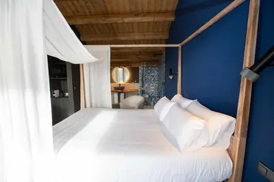 Cama o camas de una habitación en MOCHO-RURAL-HOME ULLDEMO SUITE
