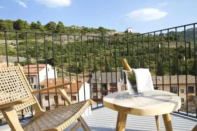 Un balcón o terraza de MOCHO-RURAL-HOME ULLDEMO SUITE