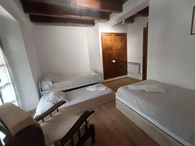 Cama o camas de una habitación en Inmocyma Residencial Linsoles-Valle de Benasque