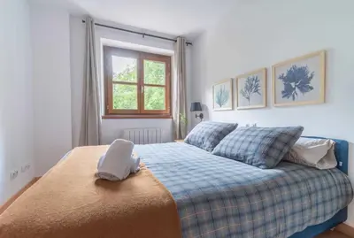 Cama o camas de una habitación en LOIRA CASA SANCHINES: Cálido dúplex en Benasque