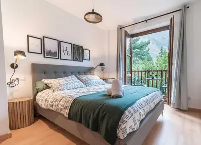 Cama o camas de una habitación en LOIRA CASA SANCHINES: Cálido dúplex en Benasque