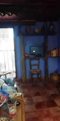 Una televisión o centro de entretenimiento en apartamento Rejola