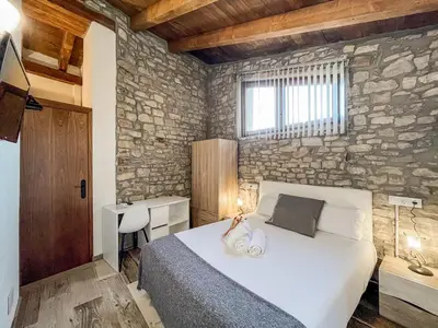 Cama o camas de una habitación en El Forn de Freixenet - Casa Rural Completa