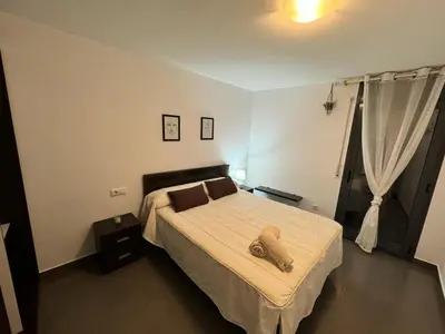Cama o camas de una habitación en APARTAMENTO ROMELIA bajo A