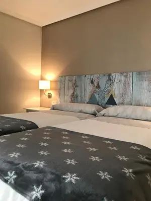 Cama o camas de una habitación en Apartamento Estiviellas, Pirineo
