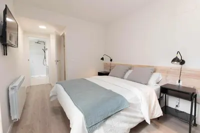 Cama o camas de una habitación en Sky Biescas II by BeValle