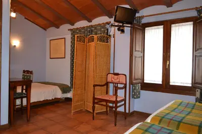Cama o camas de una habitación en Hostal Santa Agueda