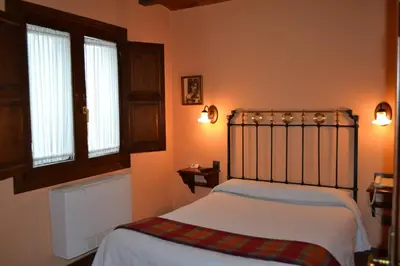 Cama o camas de una habitación en Hostal Santa Agueda