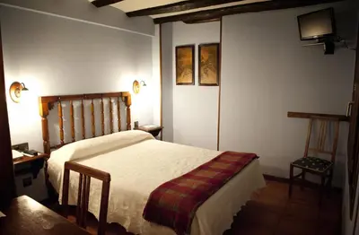 Cama o camas de una habitación en Hostal Santa Agueda