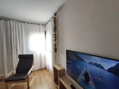 Una televisión o centro de entretenimiento en Inmocyma Cerler Prados de Velarta C 1-3