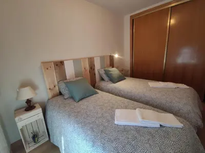 Cama o camas de una habitación en Inmocyma Cerler Prados de Velarta C 1-3