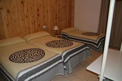 Cama o camas de una habitación en H Ribera