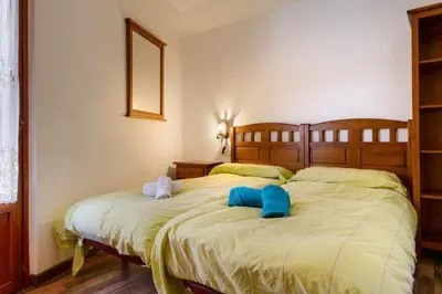 Cama o camas de una habitación en edificio CAPERAN 1