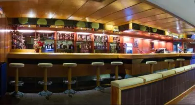 El salón o zona de bar de Acogedor apartamento a pie de pistas cota 1500
