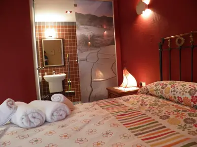 Cama o camas de una habitación en Hostal Rural Txapi Txuri Logis Hotels