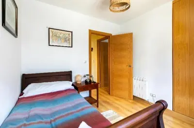 Cama o camas de una habitación en Apartamentos Búbal Peña Telera