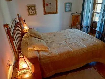 Cama o camas de una habitación en Apartamentos Búbal Peña Telera