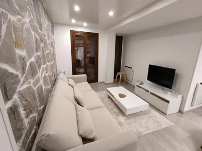 Una televisión o centro de entretenimiento en Bozocarro Descanso