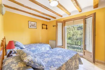 Cama o camas de una habitación en Casa Rural Teulé