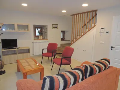 Una televisión o centro de entretenimiento en Casa Rural Sardas 60m2 con GARAGE - Sabiñanigo