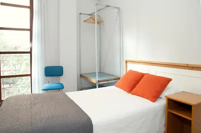 Cama o camas de una habitación en Apartamentos Sabinas Don Jaime