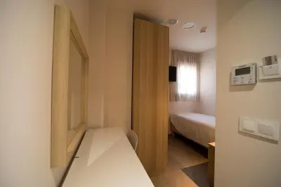 Cama o camas de una habitación en Hostal Martínez