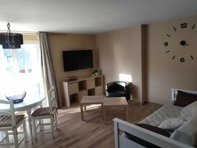 Una televisión o centro de entretenimiento en CHECK-IN CASAS El rinconet