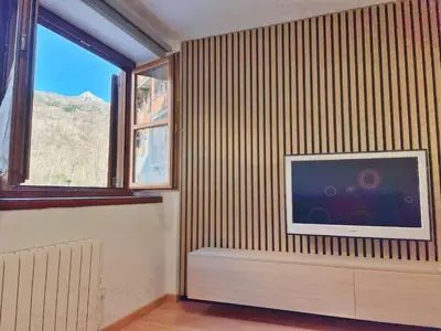 Una televisión o centro de entretenimiento en Apartamento Valle de Alba