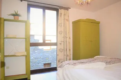 Cama o camas de una habitación en Apartament acollidor amb una gran llar de foc by RURAL D'ÀNEU