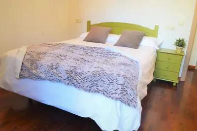 Cama o camas de una habitación en Apartament acollidor amb una gran llar de foc by RURAL D'ÀNEU